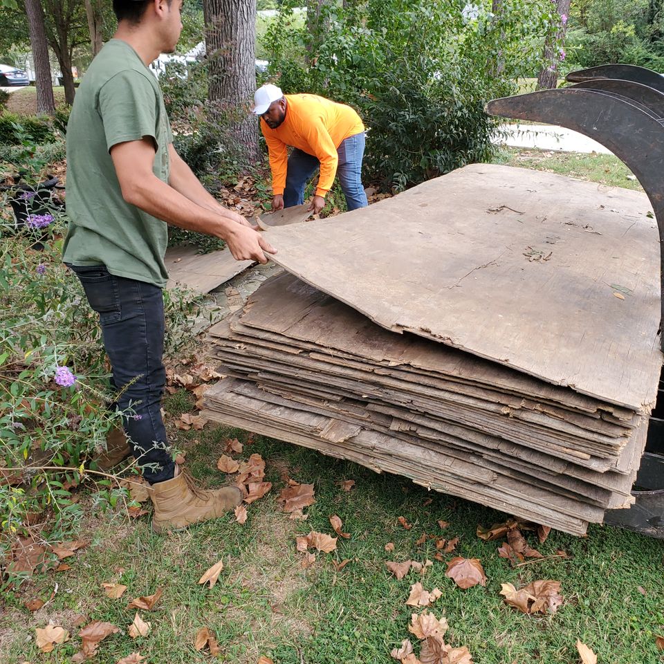Timberman crew sectioning a large oak during a tree removal in a Raleigh, NC back yard